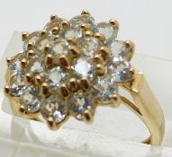 A 9ct gold ring set with a cluster of quartz, size J, 3g.