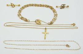 A 9ct gold gate bracelet, a 9ct gold cross, a Edwardian brooch set with seed pearls and a 9ct gold