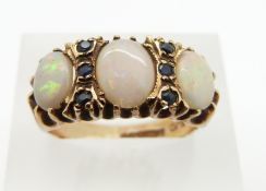 A 9ct gold ring set with opals and sapphires, 4.5g, size P