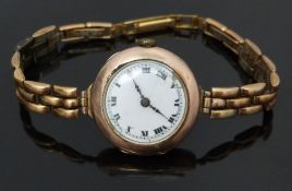 Continental 9ct gold ladies wristwatch with black Roman numerals, white enamel dial and 15 jewel