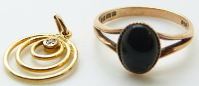 A 9ct gold ring (1.5g) and a pendant set with a diamond