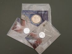 Royal Mint two 'Timeless First' £20 silver coins, together with a 2001 silver Britannia