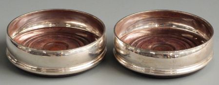 Pair of feature hallmarked silver wine coasters, London 1992 maker David R Mills, diameter 13cm