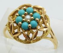 A 9ct gold ring set with a central pearl and turquoise, 3.5g, size P