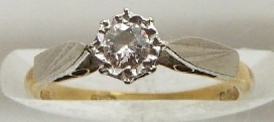 An 18ct gold ring set with a diamond in a platinum setting, 2.2g, size I