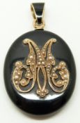 Victorian locket set with black enamel and seed pearls, with glass compartment verso, 3.2 x 4.2cm