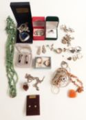 A collection of silver jewellery including charm bracelet, rings, earrings, necklaces, malachite and