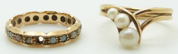 A 9ct gold ring set with pearls and a 9ct gold eternity ring set with opals, 5.2g,