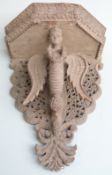 Nepalese/ Anglo Indian carved figural shelf bracket with fretwork decoration, the central figure the