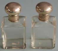 Pair of George V hallmarked silver topped dressing table scent bottles, London 1916 maker Charles