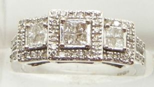 An 18ct white gold ring set with square cut and round cut diamonds, 3.7g, size L