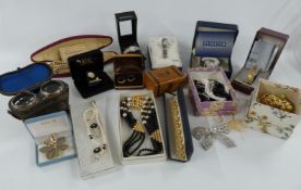 A collection of costume jewellery including rolled gold bands, watches, mauchline ware box, opera