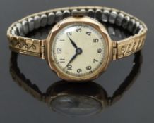 Buren 9ct gold ladies wristwatch with blued hands, black Arabic numerals, champagne dial and