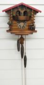 Three train German cuckoo clock with musical dancers feature