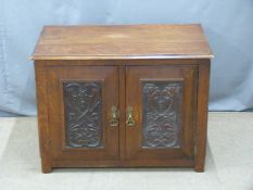 Small oak cabinet with carved doors, W82 x D52 x H60cm