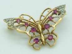 A 9ct gold butterfly brooch set with rubies and diamonds, 3.1 x 2.2cm