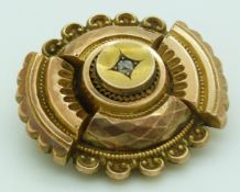 Victorian brooch set with an old cut diamond verso glass compartment, 3cm