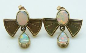 A pair of 9ct gold earrings each set with two oval opals, 4.8g