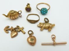 A collection of charms including 9ct gold heart, tea pot, pig, etc, a 9ct gold T bar, and a 9ct gold