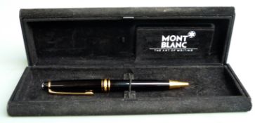 Montblanc ballpoint pen with black resin barrel and cap, gilt fittings and star cap