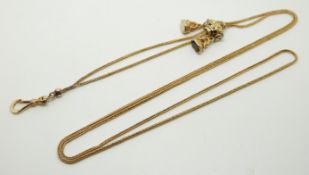 Victorian yellow metal fob chain with an enamel slider and two seals, 17g, 50cm drop