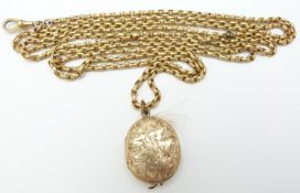 Victorian 9ct gold guard chain, 70cm long, 37.9g  and an oval mourning locket with engraved