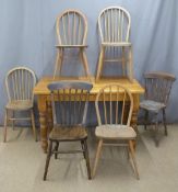 Pine kitchen or dining table, L122 x W77 x H77cm, together with four possibly Ercol hoop back chairs
