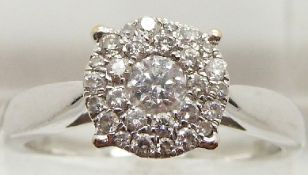 An 18ct white gold ring set with a cluster of diamonds, total approximately 0.5ct, 4.8g, size P