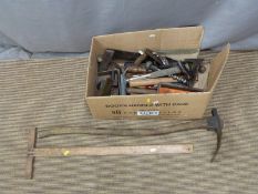 A collection of largely woodworking tools including adze, t-square, chisels etc