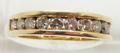 An 18ct gold half eternity ring set with twelve round brilliant cut diamonds, approximately 1ct