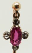 Victorian stick pin set with an oval pink sapphire and rose cut diamonds