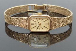 Omega 9ct gold ladies wristwatch with two tone hands and baton markers, gold dial and signed 17