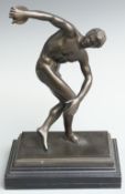 Bronze or similar Greek Olympian discus thrower on ebonised base, 38cm tall