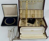 A collection of costume jewellery including 9ct gold earrings, silver locket, silver ingot,