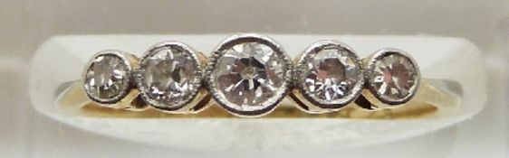 An 18ct gold ring set with five diamonds, 1.9g, size J/K