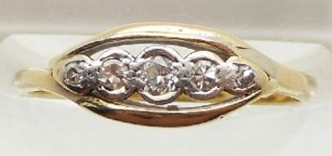 An 18ct gold ring set with five diamonds, 2.1g, size L