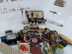 A collection of costume jewellery including beads, silver earrings, silver plate, silver locket,
