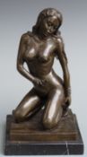 A bronze model of a nude lady kneeling, set on marble plinth, approximately 32cm tall