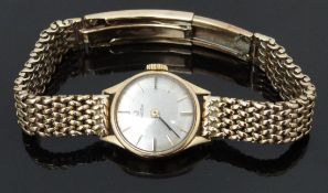 Omega 9ct gold ladies wristwatch ref. 5115499 with black hands, two-tone hour markers, silver dial