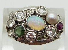 An 18ct white gold ring set with four round cut diamonds each measuring approximately 0.2ct, six