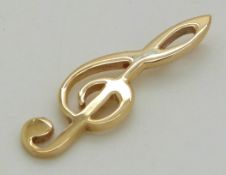 A 9ct gold pendant in the form of a musical note, 2.2g
