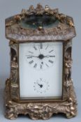 19thC figural brass/silver plated carriage clock, the enamel Roman dial with Arabic alarm