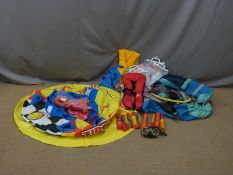 Inflatable water sports ring together with six inflatable life jackets etc