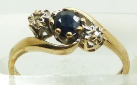 A 9ct gold ring set with a sapphire and two diamonds, 2.0g, size L