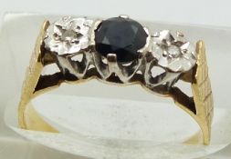 An 18ct gold ring set with a sapphire and two diamonds, 3.0g, size K