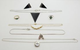 A collection of silver jewellery including rings and necklaces
