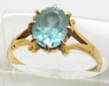 An 18ct gold ring set with an oval cut zircon, 4.0g, size P