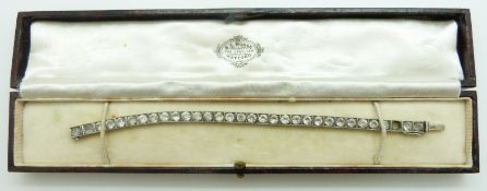 A silver bracelet set with paste in original Watford box
