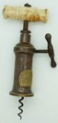 Victorian Heeley & Sons side action corkscrew with bone handle and set with royal coat of arms.