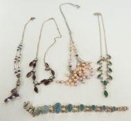 A silver necklace set with garnets and pearls, a silver bracelet set with beryl cabochons, two